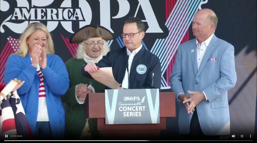 America250 backdrop crashes toward Gov. Josh Shapiro at announcement event