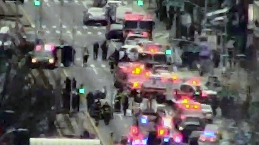 At least 13 people injured in New York subway shooting, officials confirm