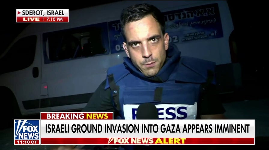 FOX News’ Trey Yingst takes cover from Hamas rocket attack during live report