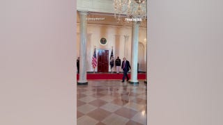 Trump greets Oklahoma State men's golf team with golf swing