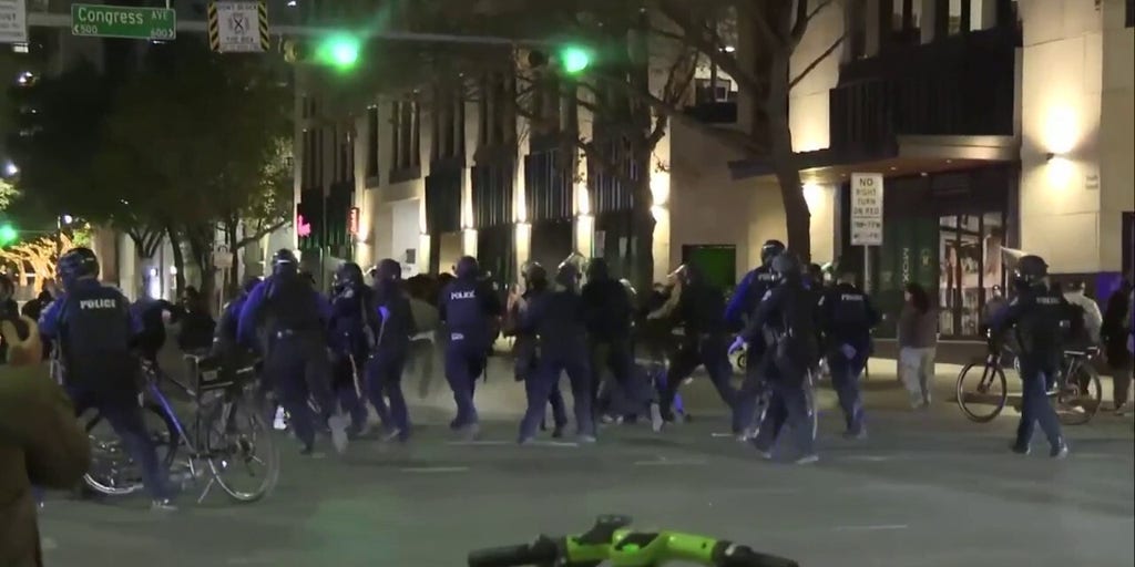 Austin Police Department in riot gear detain anti-ICE protests