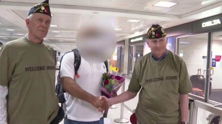 Afghanistan translator greeted by veterans after arriving in US with visa