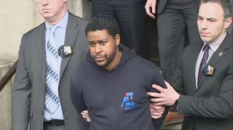 Perp walk: New Yorkers shout at suspect in fatal shooting of NYPD police officer, who now faces charges