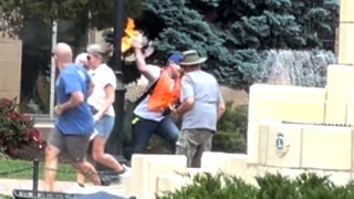Mohamed Soliman throws an incendiary device into a group of pro-Israel supporters.