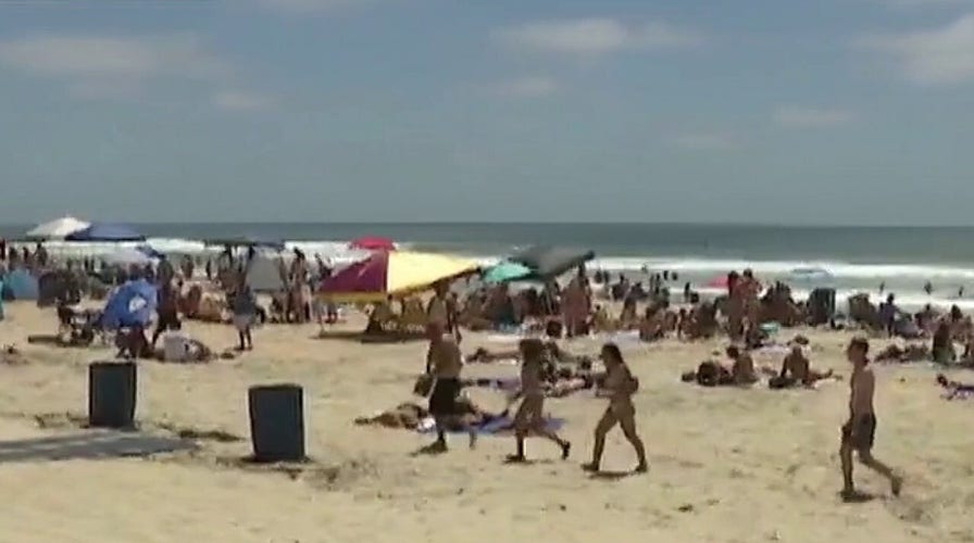 Crowds seen packing beaches amid coronavirus pandemic