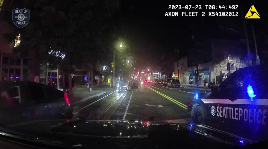 Seattle crowd blocks police, jumps on car hours before shooting at illegal street race