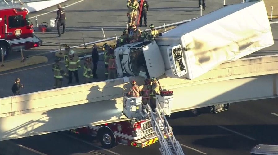 Houston driver rescued from box truck hanging over Texas highway
