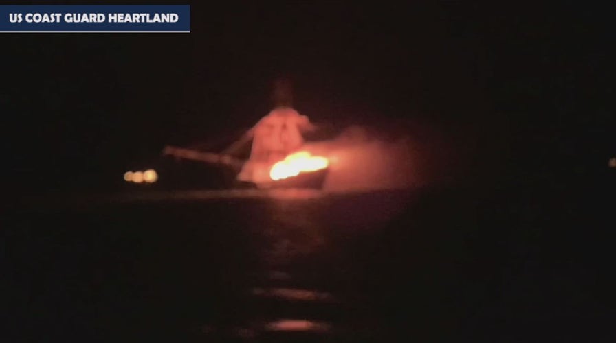 Coast Guard rescues four from vessel fire