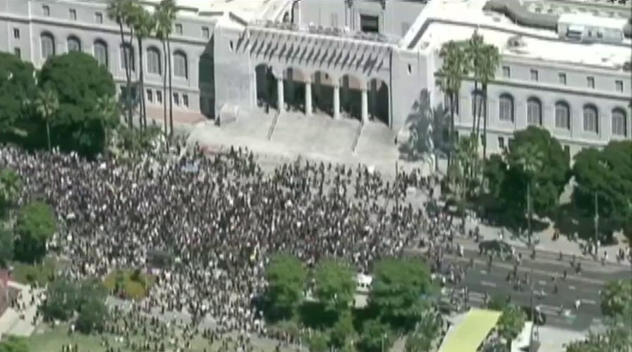 Thousands of peaceful demonstrators march through Los Angeles to protest George Floyd's death