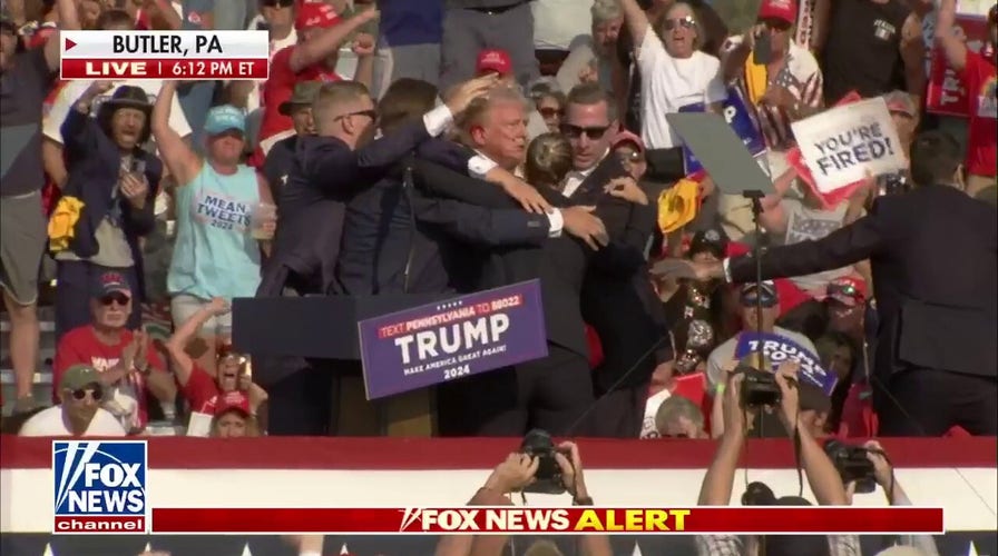 Trump led off stage after '4 or 5 shots' heard at rally