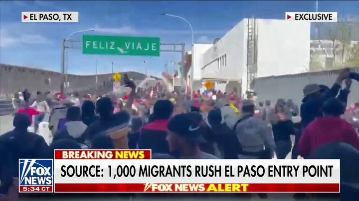 Migrants rush El Paso bridge attempting to gain entry into the US 