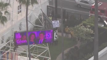 Man climbs KTLA radio tower holding ‘Free Billie Eilish’ sign
