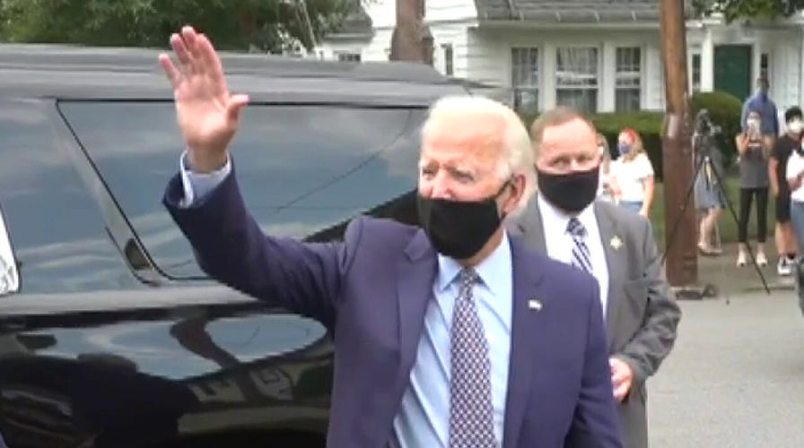 Biden pauses for photos outside of his childhood home in Pennsylvania