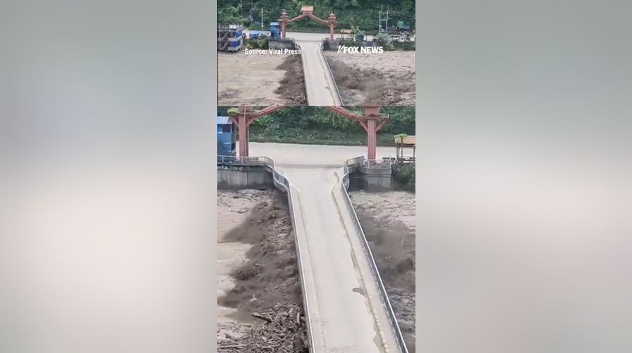 Bridge swept away as waters surge through Nepal
