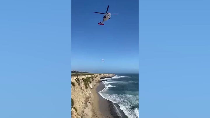 Video shows kite surfer being rescued from California beach