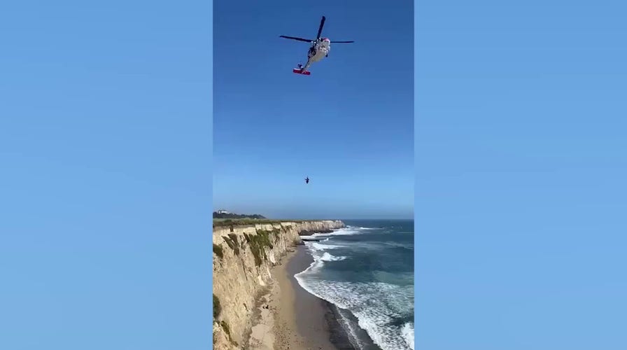 Video shows kite surfer being rescued from California beach