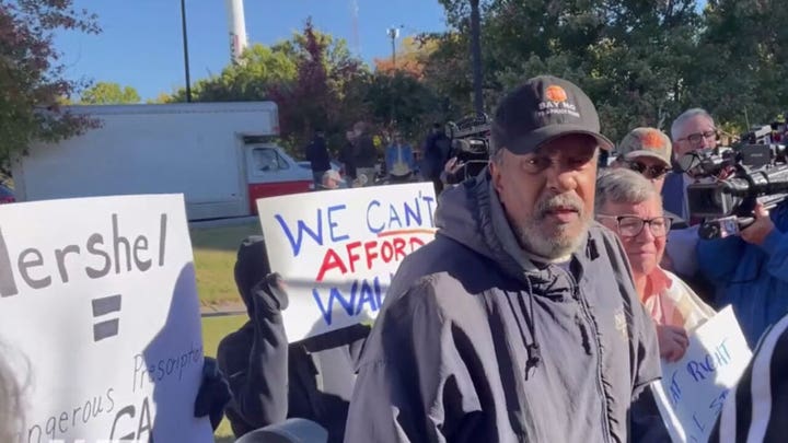 Protesters reportedly attack Herschel Walker with racial slur, crash press conference on Warnock evictions