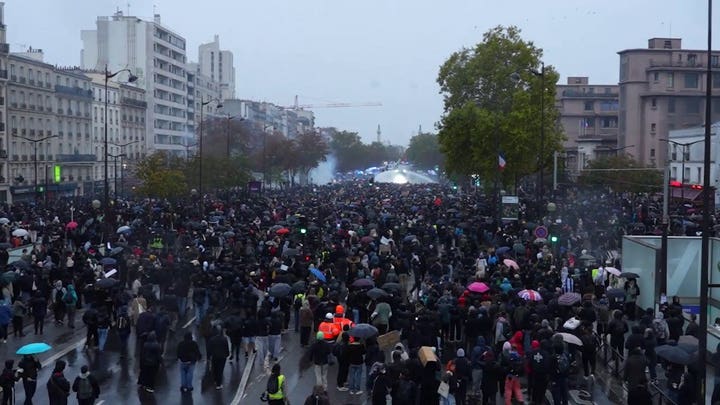 Police in Paris fire water cannons at protesters