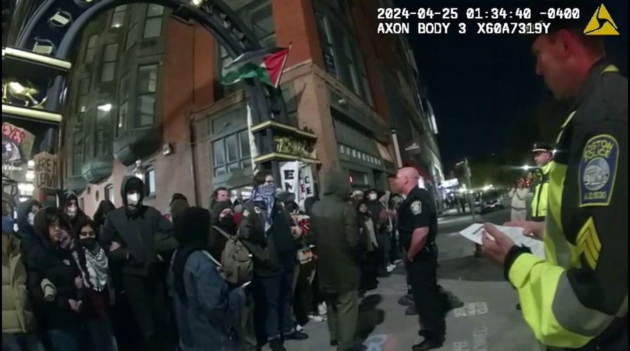 Boston police officer attempts to reason with anti-Israel protesters