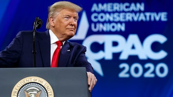 Trump mocks Bloomberg’s height by crouching behind podium at CPAC