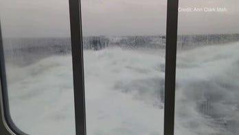 Large waves hit glass of Antarctica cruise ship as it navigates the Drake Passage