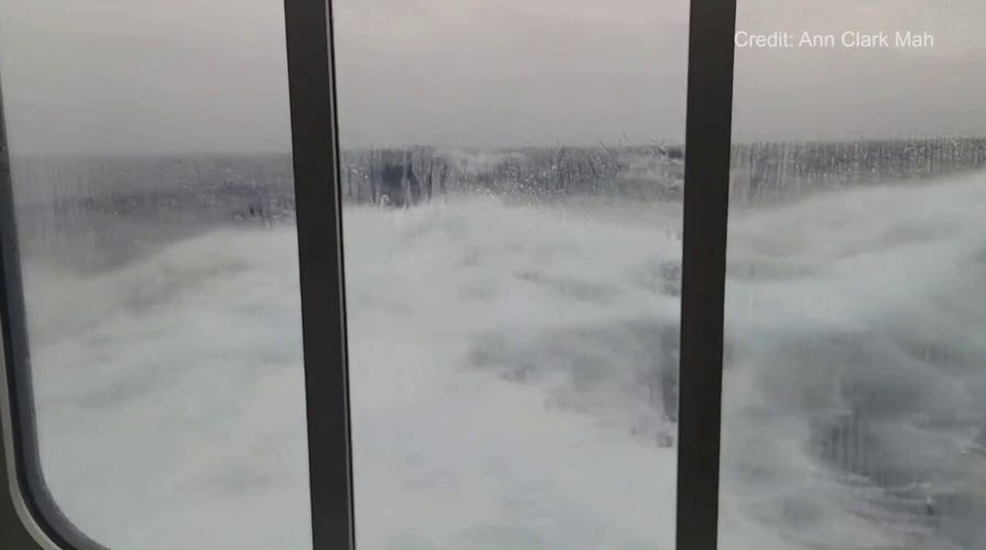 Large waves hit glass of Antarctica cruise ship as it navigates the Drake Passage