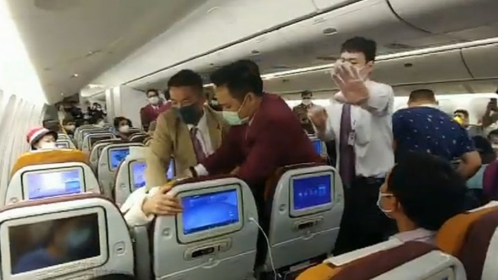 Thai Airways passenger forcibly restrained after intentionally coughing on crew member during delay: report