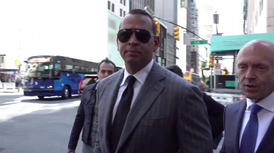 Alex Rodriguez seen walking in Manhattan near Trump Tower as press gathered outside to catch former president Donald Trump's arrival.