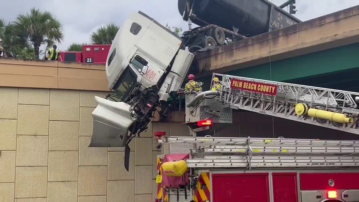 Palm Beach County Fire Department rescues truck driver from dangling 18-wheeler