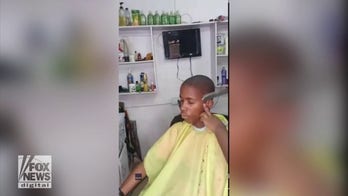Hairdresser cuts clients hair with knife in shockingly successful video
