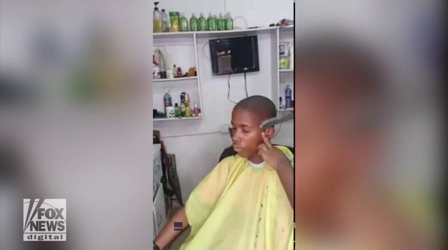 Hairdresser cuts clients hair with knife in shockingly successful video