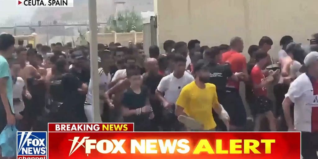 Migrants storm border of Spanish city of Ceuta as national emergency requested