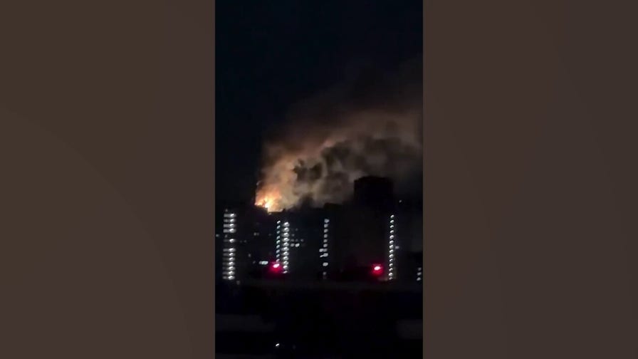 Baby sleeps as explosions light up Kyiv during massive Russian attack