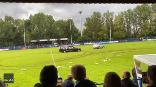 Chaos at an English soccer game as a hearse speeds out onto the field - Fox News