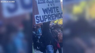 Protester at NYU holds giant 'Jewish Supremacy' sign - Fox News