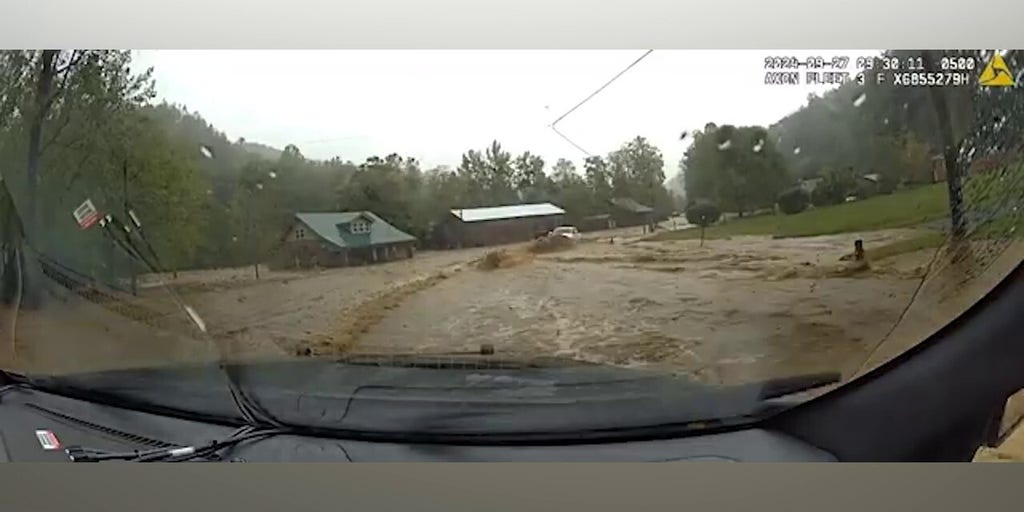 Video shows state trooper rescued after being swept up by Hurricane Helene floodwaters
