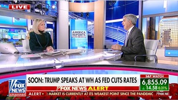 Fed cuts interest rates as Trump touts booming economy