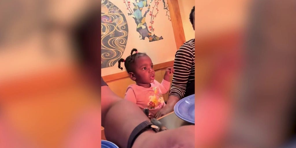 Baby awestruck by first hibachi restaurant experience