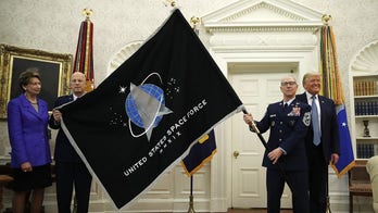 Space Force flag unveiled in Oval Office, presented to Trump
