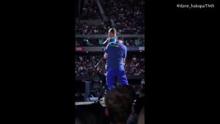 Chris Martin reacts after falling through trapdoor - Fox News