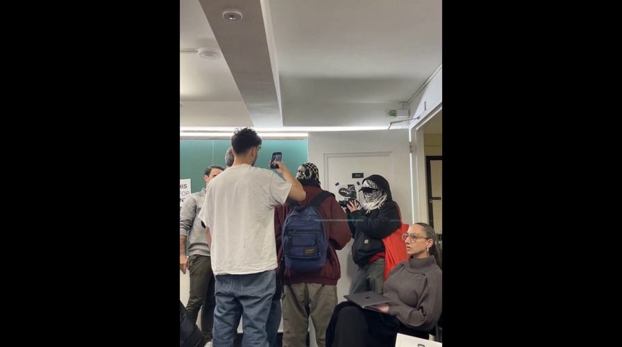 Masked protesters disrupt Columbia University class with signs calling to 'Crush Zionism'