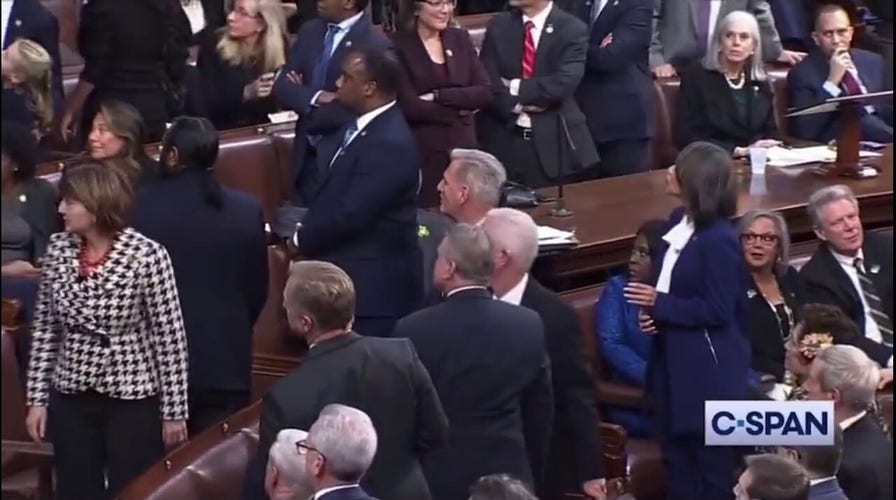 Mike Rogers lunges at Matt Gaetz during House speaker voting, other members intervene.