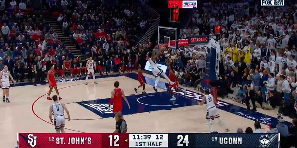 Tarris Reed slams down a two-handed jam, extending UConn's lead over St. Johns