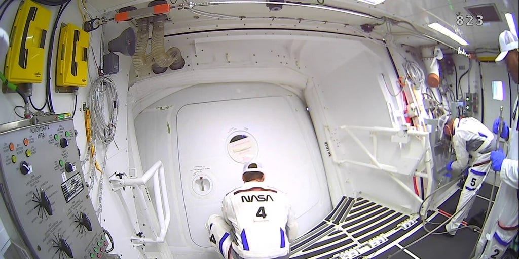 Hatch on Artemis II capsule closes as astronauts prepare for lunar mission