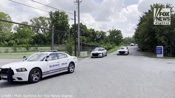 Police cars arrive at a suspected area of Eliza Fletcher's disappearance