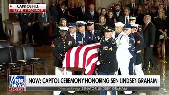Military honor guard carries Sen. Lindsey Graham's casket into Capitol Rotunda