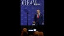 WATCH: President Trump stops young boy from wandering off stage