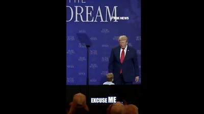 WATCH: President Trump stops young boy from wandering off stage