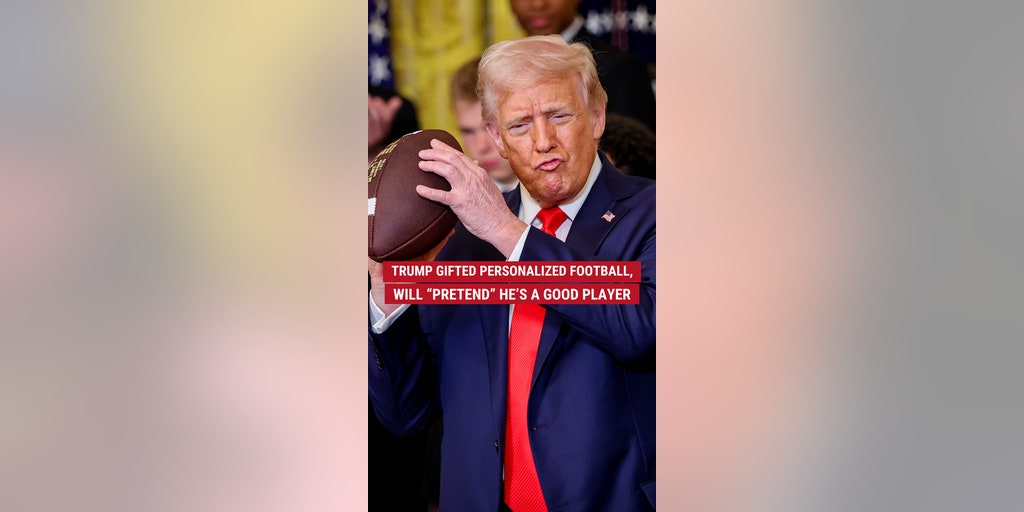 Trump given personalized football, will "pretend" he's a good player