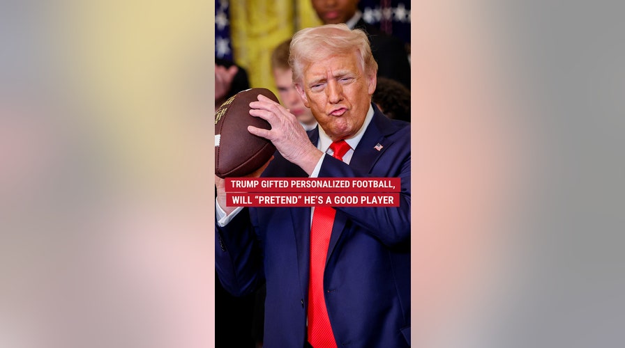 Trump given personalized football, will "pretend" he's a good player